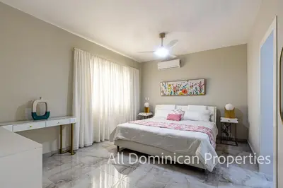 a bedroom with a bed in a room at Hill Side Condos - Hispaniola in Sosúa
