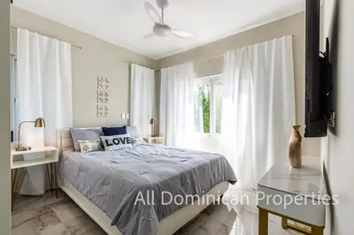 a bedroom with a bed and a window at Hill Side Condos - Hispaniola in Sosúa