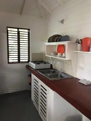 a small kitchen with a sink and a window at Hotel Casa Robinson in Las Terrenas
