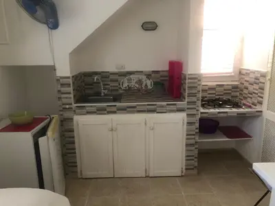 a kitchen with a sink and a counter top at Hotel Casa Robinson in Las Terrenas