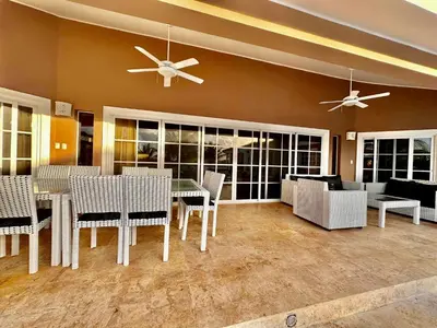 a dining room with a table and chairs at Casa Linda Club in Sosúa