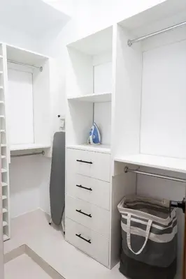 a white closet with white cabinets and a shelf at Apartamento en el gran santo Domingo in Santo Domingo