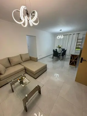 a living room with a couch and a dining room at RESIDENCIAL LEGADO Apto 1 A in Azua