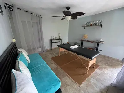 a living room with a couch and a table at Exclusive Mountain Villa with Ocean View near Puerto Plata in Maimón