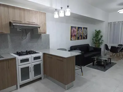 a kitchen and living room with a stove and a couch at Boca del Mar III, apto 707 in Boca Chica