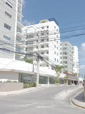 an empty street in front of a tall white building at Boca del Mar III, apto 707 in Boca Chica