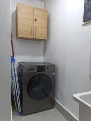 a washing machine in a corner of a room at Boca del Mar III, apto 706B in Boca Chica