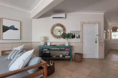 a bedroom with a bed and a mirror on the wall at Playa Las Ballenas Oceanfront in Las Terrenas