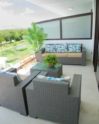a living room with two couches and a table at The Peña family suite in Punta Cana