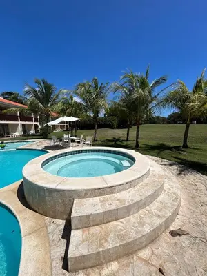 a swimming pool with a stone stair around it at Disfruta momentos inolvidables in Santo Domingo