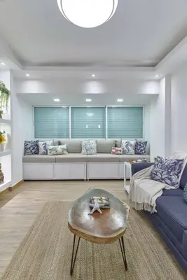a living room with a couch and a table at El Retiro Juan Dolio Beach by Elital Luxury in Villas del Mar
