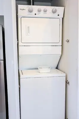a white refrigerator with a stove in a kitchen at Chic Centric 1BR Apt, King Bed in Los Prados