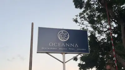 a sign for an oceanmite sign on a street at guababerry Juan dolio in Los Conucos