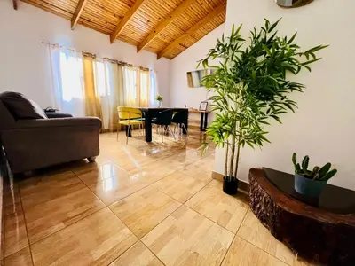 a living room with a couch and a table at Apartamento Brisas de la Montaña in Jarabacoa
