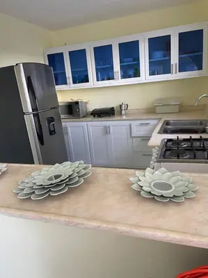 two dishes on a counter in a kitchen at cabrera villa con vista al mar in Cabrera