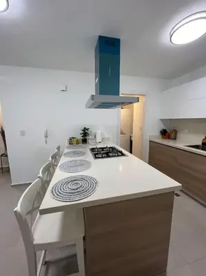 a kitchen with a stove and a counter top at Apartment in Playa Nueva Romana in San Pedro de Macorís