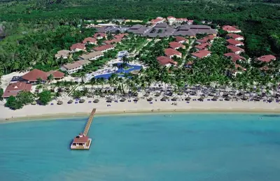 an aerial view of a resort with a boat in the water at Bahia Principe Grand La Romana - All Inclusive in La Romana