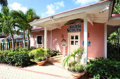 a pink building with plants in front of it at Bahia Principe Grand La Romana - All Inclusive in La Romana