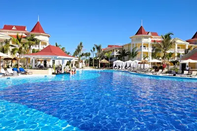 a large swimming pool in front of a resort at Bahia Principe Luxury Bouganville - Adults Only All Inclusive in La Romana