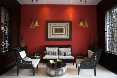 a living room with red walls and chairs and a couch at Bahia Principe Luxury Bouganville - Adults Only All Inclusive in La Romana