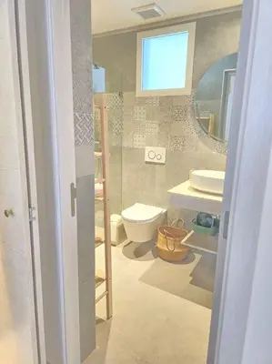 a bathroom with a toilet and a sink at Luxury Apartment IZHA 202 in La Laguna