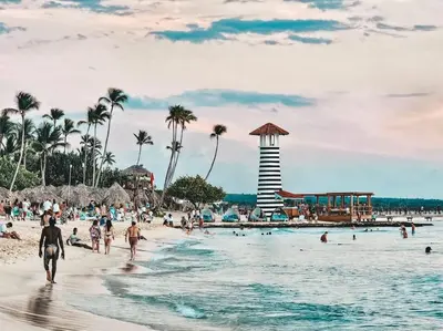 a group of people on a beach with a lighthouse at Luxury Apartment IZHA 202 in La Laguna
