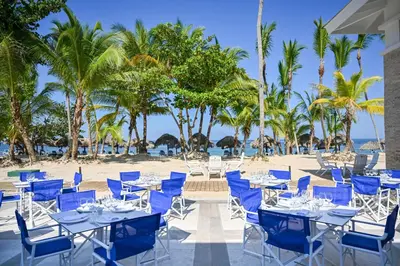 a group of tables and chairs on the beach at Bahia Principe Grand El Portillo - All Inclusive in Las Terrenas