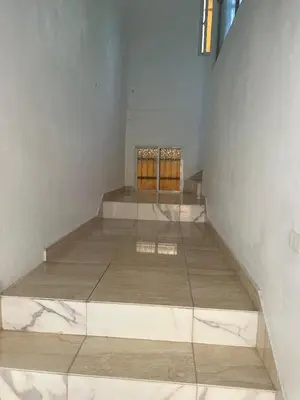 a staircase in a building with a wooden door at Casa las Américas in La Alianza