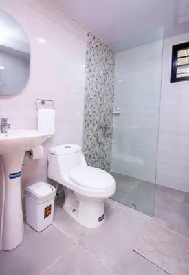 a bathroom with a toilet and a sink and a shower at APT 3 HAB Avenida España Piso 1 in La Viva