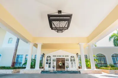 a large building with a chandelier hanging from the ceiling at Eurostars Grand Cayacoa in Santa Bárbara de Samaná
