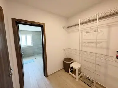 a room with a closet with a stool and a door at Peaceful haven overlooking the golf course in Punta Cana