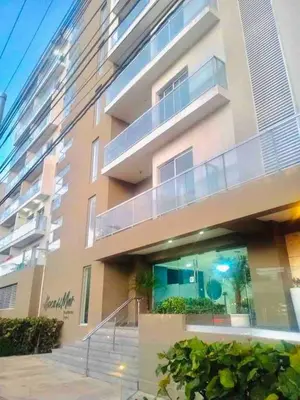 a apartment building with a staircase in front of it at Boca chica Apartment Near the bech in Boca Chica