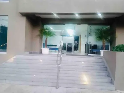 a building with a staircase in front of a building at Boca chica Apartment Near the bech in Boca Chica