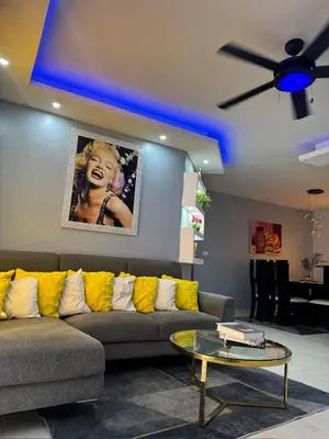 a living room with a couch and a table at Hermoso apartamento in Santo Domingo