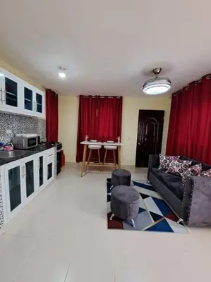 a living room with a couch and a table at Encantador Apartamento Pequeño in Hornillo
