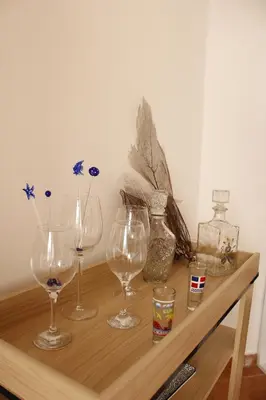 a wooden shelf with four wine glasses on it at Albatros by R&R 2 in Villas del Mar