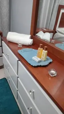 a bathroom counter with a sink and a mirror at apartamento 3 habitaciones 15 minutos aeropuerto las america in San Isidro