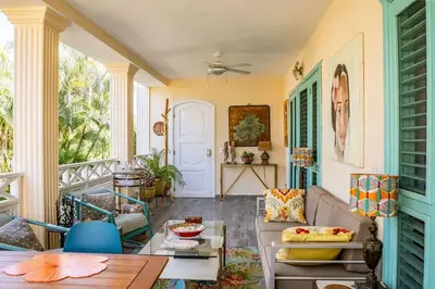 a living room with a couch and a table at Renovated Condo at the Beach Close to Everything in Las Terrenas