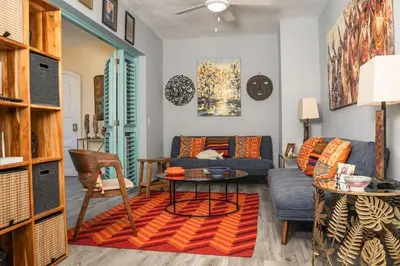 a living room with a couch and a table at Renovated Condo at the Beach Close to Everything in Las Terrenas
