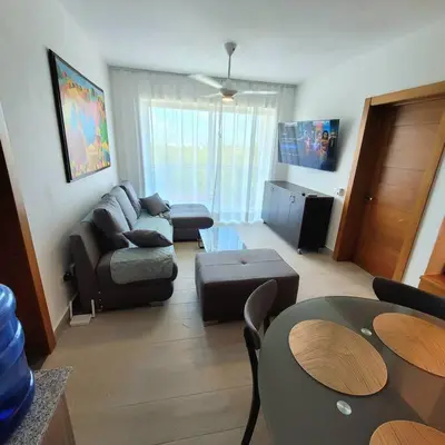 a living room with a couch and a table at Vibe Gorgeous one bedroom apartment view beach in La Laguna
