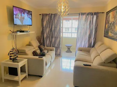a living room with two couches and a tv at Apartamento de Relajacion in Los Paredones