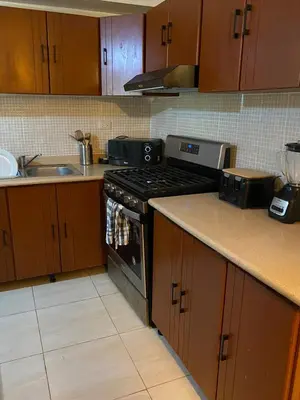 a kitchen with a stove and a sink at Apartamento de Relajacion in Los Paredones