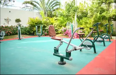 a group of childrens play equipment on a playground at Residencial Mediterraneo in Santiago de los Caballeros