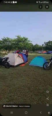 a group of tents sitting on the grass in a field at Camping in Cumayasa Kilómetros 4 1/2