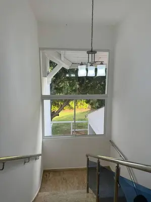 an empty room with a large window in a building at VILLA EN CASA DE CAMPO, La Romana, Rep Dom in La Romana