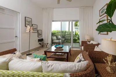 a living room with a couch and a table at Las Terrenas Haven in Las Terrenas