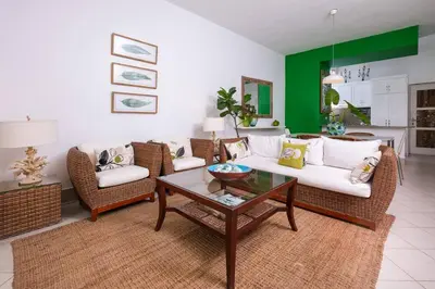 a living room with a couch and chairs and a table at Las Terrenas Haven in Las Terrenas