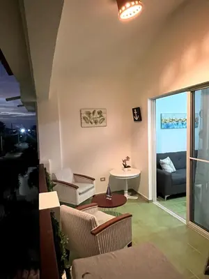 a living room with a couch and a table at Apto CGM Esmeralda in Bayahibe