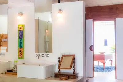 a bathroom with a white tub and a mirror at Casa Phil - Amazing Sea View Luxury Modern, Fully Staffed in Las Terrenas