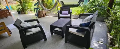 a group of chairs and a table on a patio at Rincón de Paz in Jarabacoa